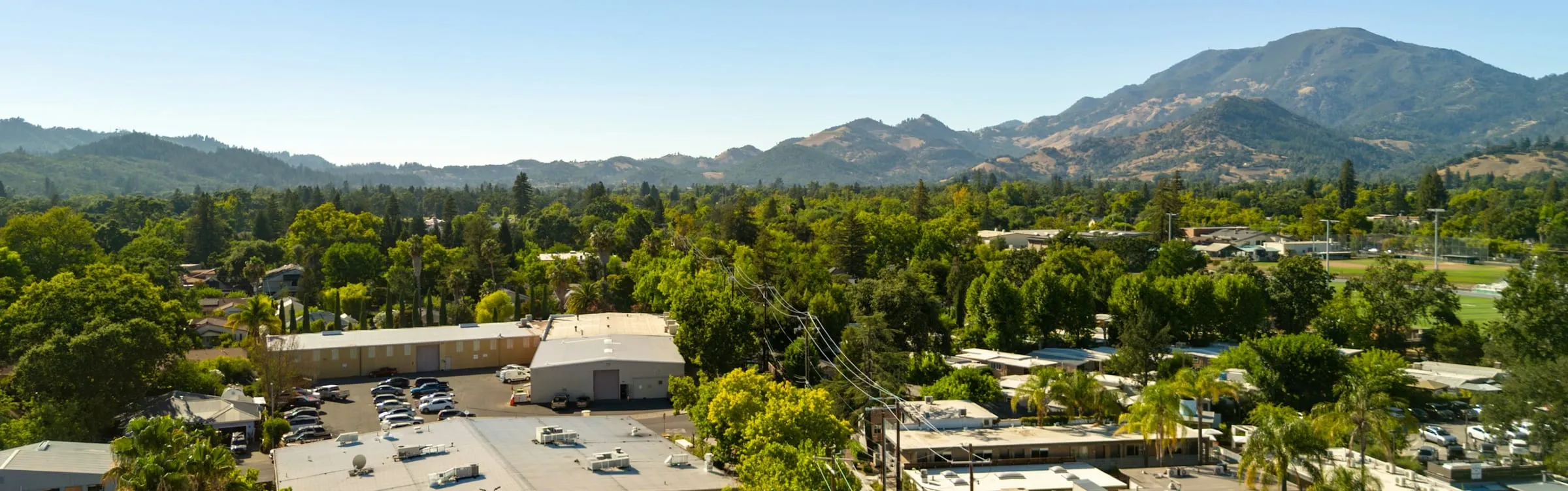 Aerial view of downtown Calistoga ringed by vineyards and mountains
