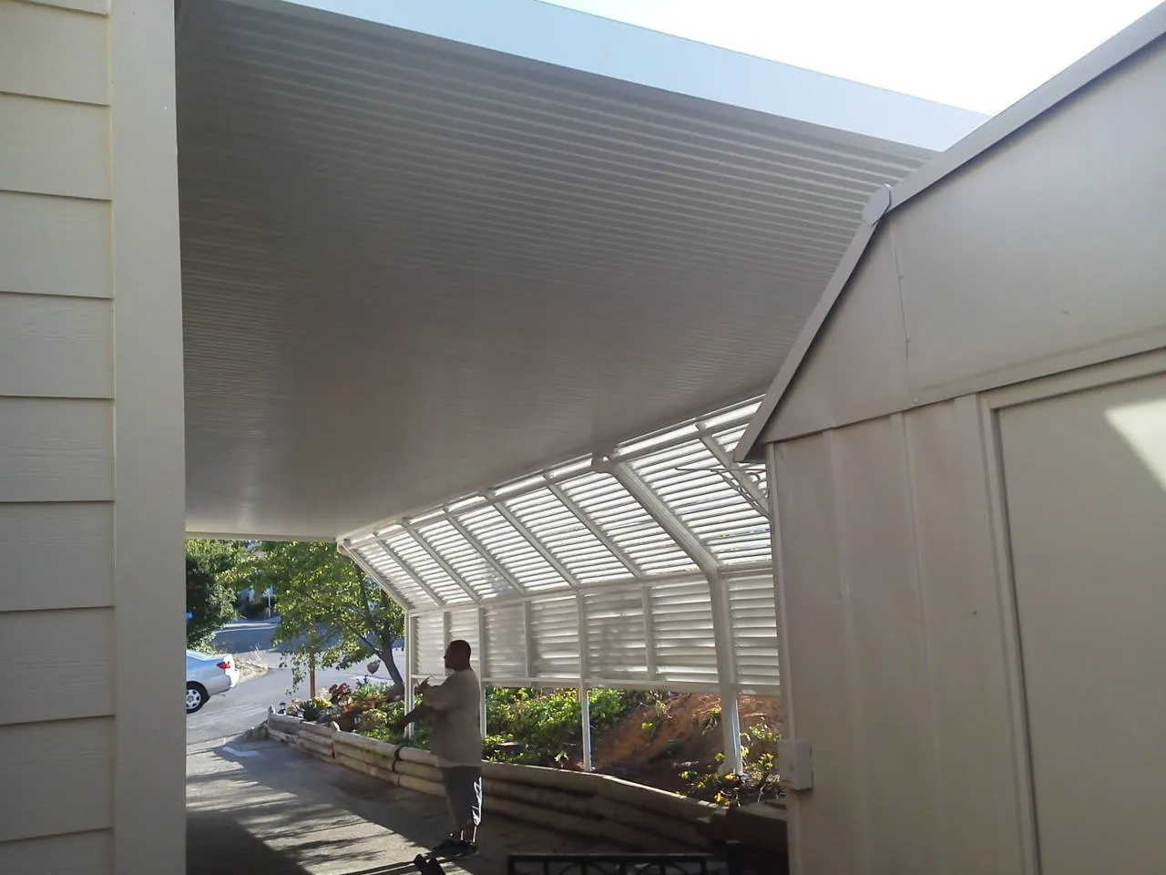 Carport and awning over a mobile home driveway