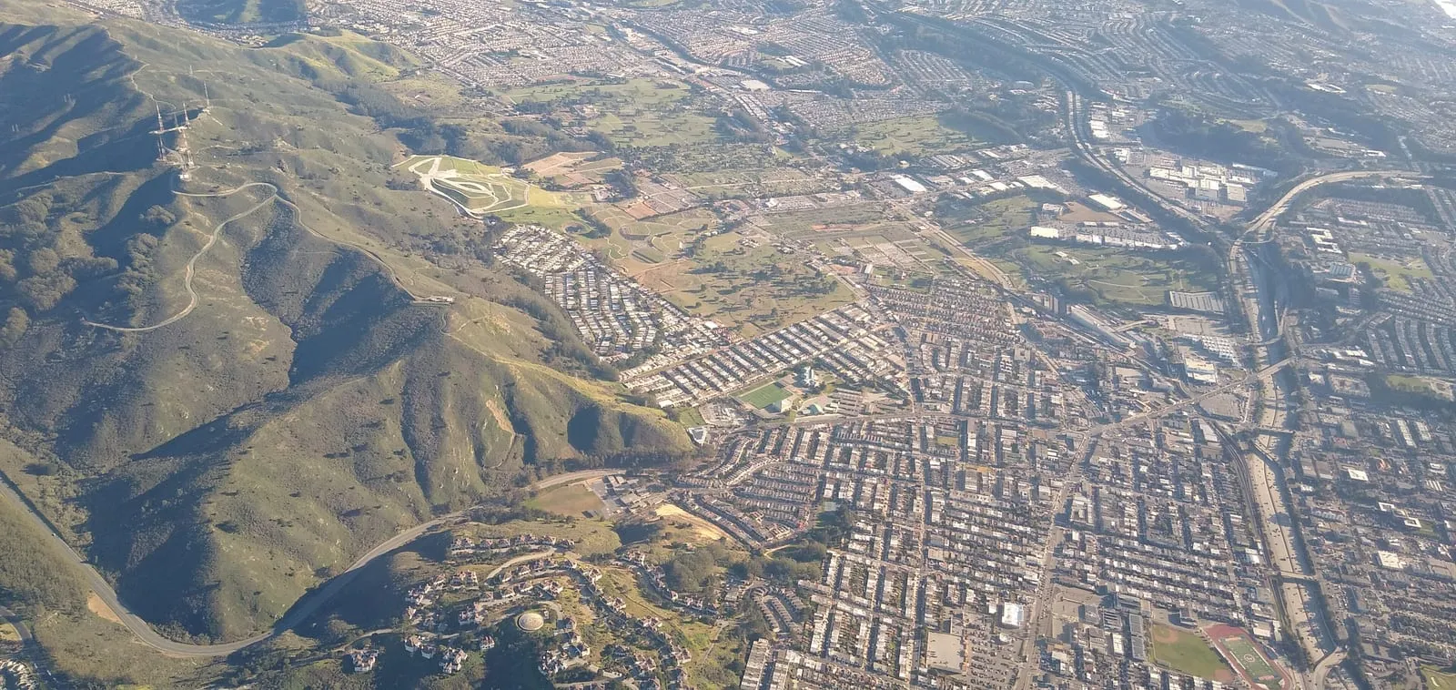 Aerial view of Daly City homes against the coastal hills