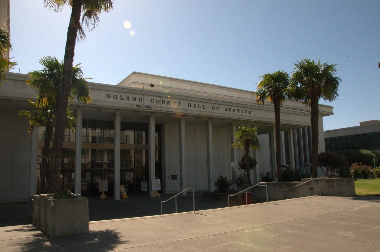 Solano County Hall of Justice with palm trees in Fairfield