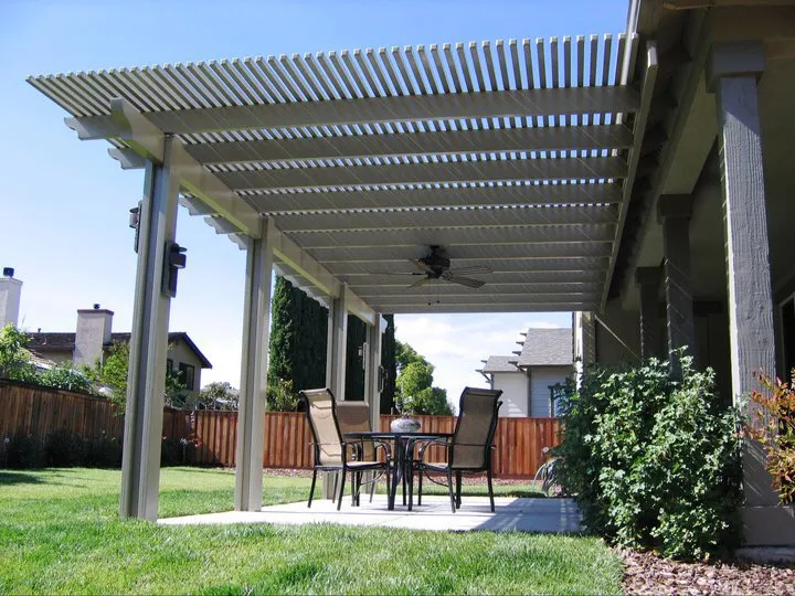 Lattice patio cover over a backyard dining set