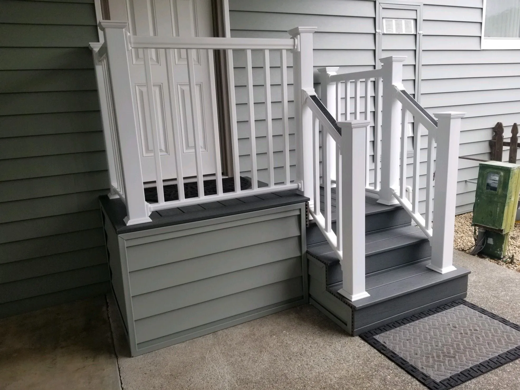 New mobile home entry stairs with landing and railings