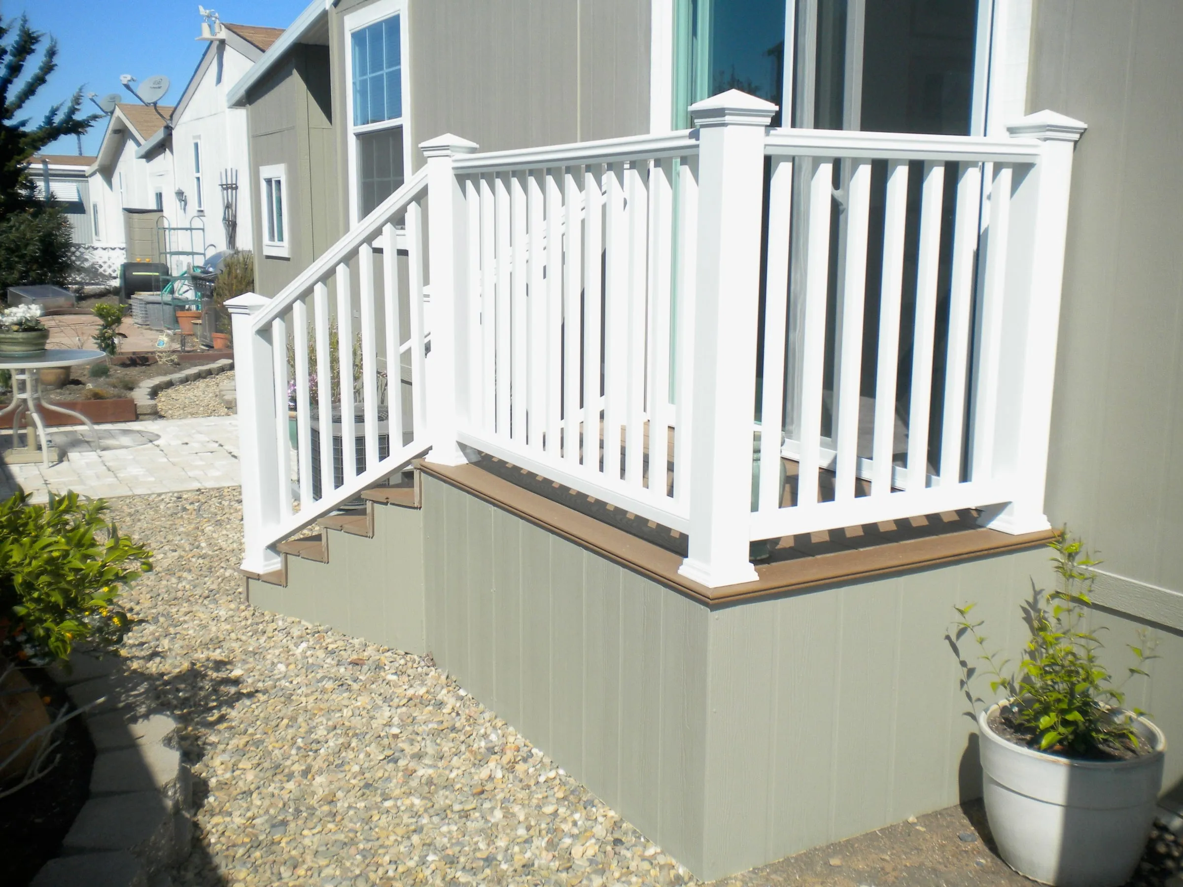 Composite mobile home stairs with white vinyl railing