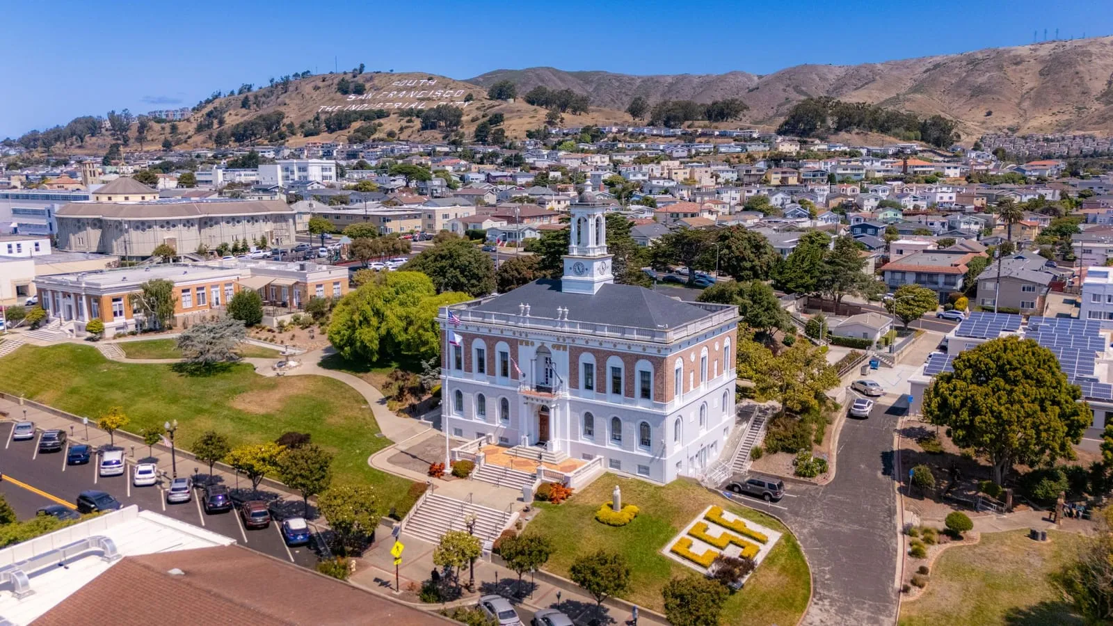 Aerial view of South San Francisco City Hall with Sign Hill behind